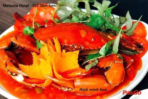 a plate of food with tomatoes and other vegetables at Melanta Hotel - FLC Sầm Sơn in Sầm Sơn