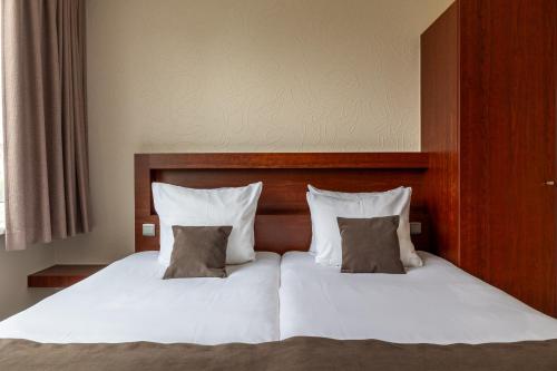 Hotel Olympia in Brugesにあるベッド