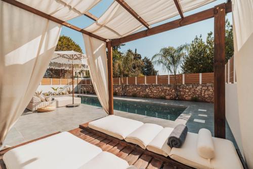 a view of the pool from the patio of a house at Nos Aqua Villas Chania in Pazinos
