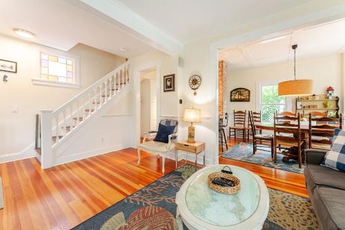 a living room with a couch and a table at Historic Seaside Downtown Mystic Home Walk to Seaport in Stonington