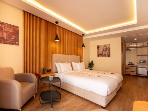 Postel nebo postele na pokoji v ubytování Unico Hotel Maarif
