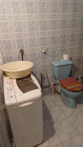 a bathroom with a sink and a toilet at Dar Al Yasmine in Tabarka
