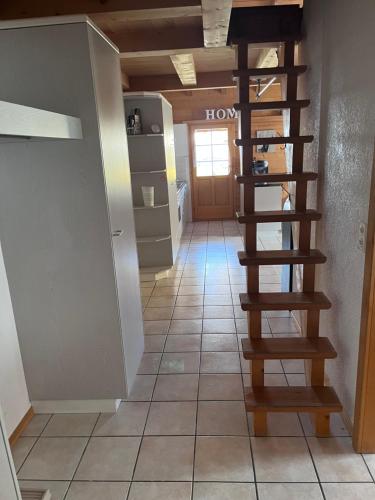 a hallway with a spiral staircase in a house at AxAlp Gipfelglück in Axalp
