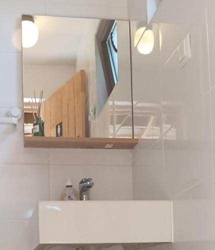 a kitchen with a sink and a mirror at Deleni Retreat - Glamping in Buzău