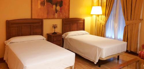 Postel nebo postele na pokoji v ubytování Sercotel Guadiana