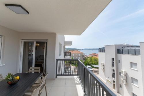 a balcony with a view of the ocean at Lush Suites in Trogir