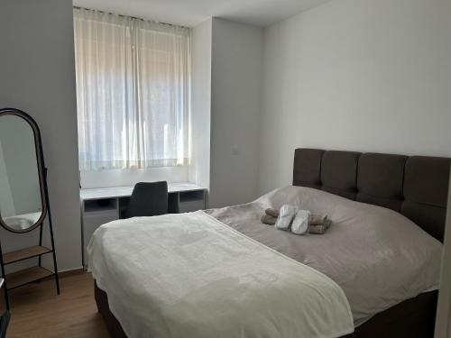 a bedroom with a bed with two pillows on it at Zavala Residence in Zavala