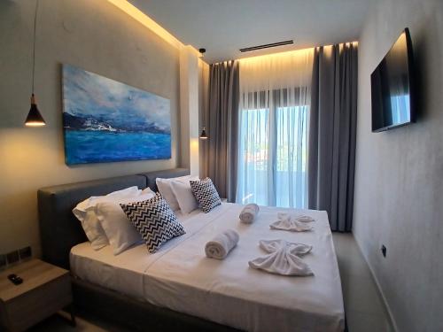 Ένα ή περισσότερα κρεβάτια σε δωμάτιο στο Helios Blue Villas Kriopigi Kassandra