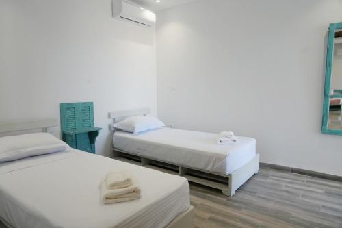 Postel nebo postele na pokoji v ubytování Le turquoise de mer