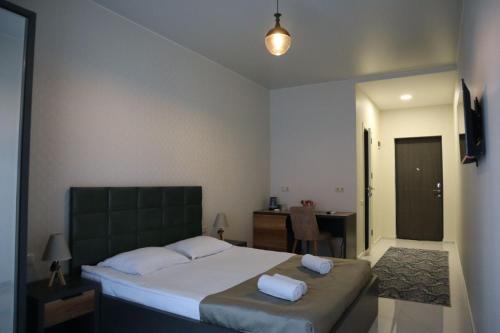 Postel nebo postele na pokoji v ubytování Horizons Hotel Rooms