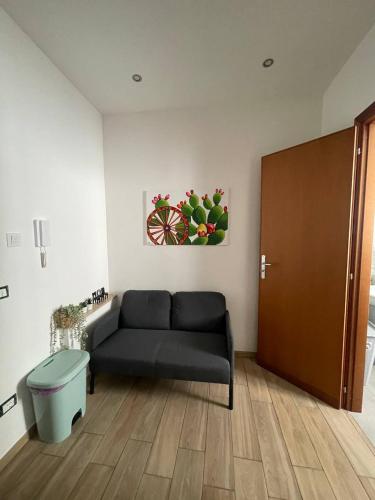 a living room with a couch and a table at Profumi di Sicilia in Cinisi