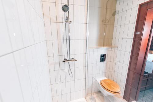 a bathroom with a shower with a toilet at The Nines in Bangor