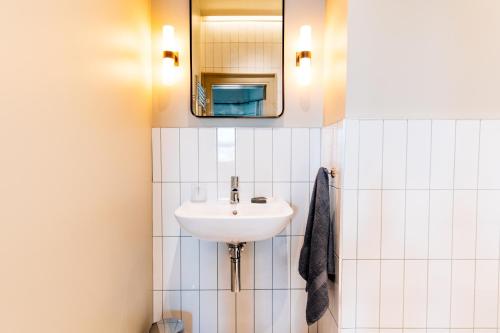 a bathroom with a sink and a mirror at The Nines in Bangor