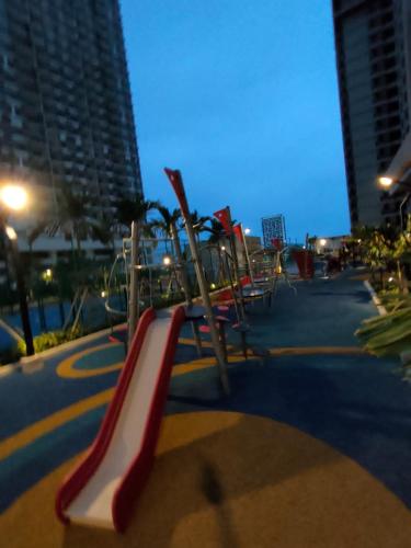 a playground with a red and white slide at BaliResidenc Sea View 2-6 Pax WaterPark 5minJonker in Melaka
