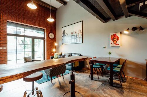 a dining room with a wooden table and chairs at Fajnové apartmány in Vyhne