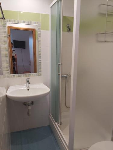 a bathroom with a sink and a shower at Villa Kate in Krk