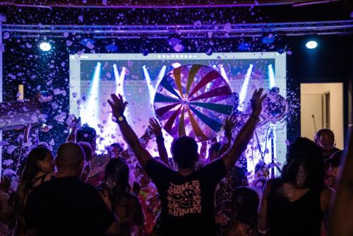a crowd of people dancing in front of a stage at Resort Camping Almafrá in Benidorm