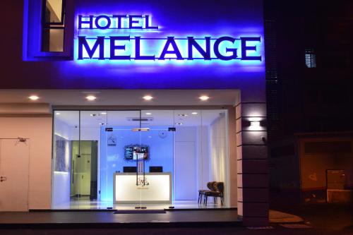 a store front with a sign that reads hotel melance at Melange Boutique Hotel Bukit Bintang in Kuala Lumpur