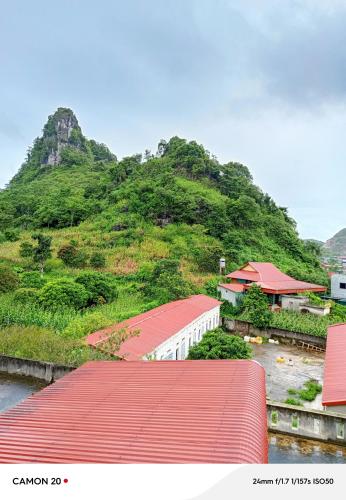 a view of a mountain with a red roof at Night Market Heart Hotel MC in Mộc Châu
