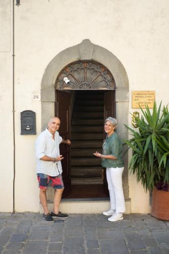 a man and a woman standing outside of a door at Le Terrazze Del Chianti b&b Residenza d'Epoca e di Charme in Tavarnelle in Val di Pesa