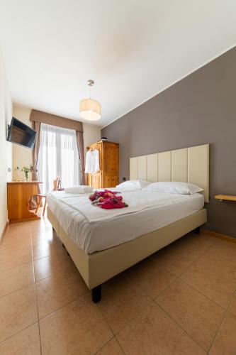 Letto o letti in una camera di Agritur Eden Marone