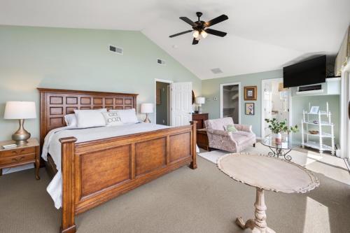 a bedroom with a bed and a ceiling fan at 37 Wamphassuc Rd Chteau Stonington in Stonington