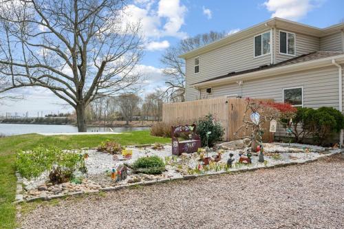 a garden in the front yard of a house at 37 Wamphassuc Rd Chteau Stonington in Stonington