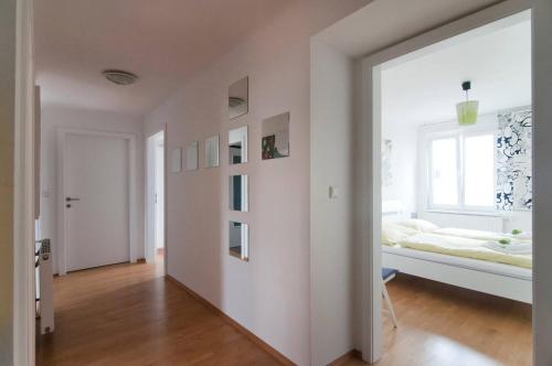 a white room with a bed and a window at Room in Rooftop Apartment in Vienna