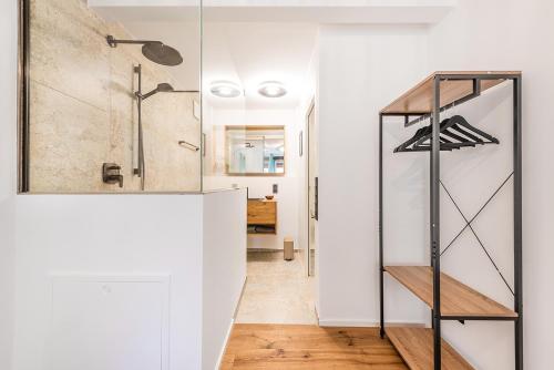 a hallway with a walk in closet and a glass door at Kubaliebe in Allensbach