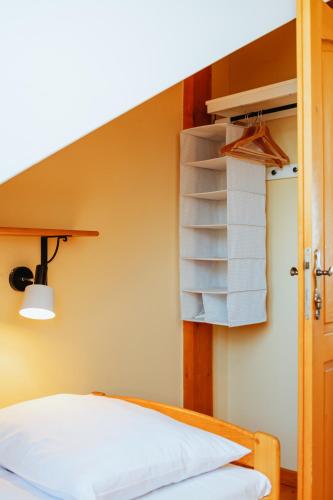 a bed in a room with a bunk bed with a ladder at Penzion U maléřa in Hroznová Lhota