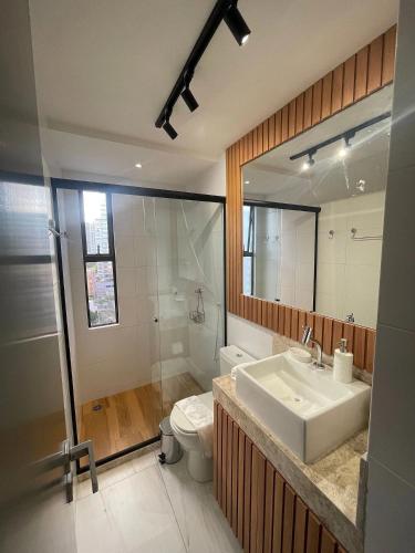 a bathroom with a sink and a toilet and a shower at Mardisa Design by Jess Hospedagens in João Pessoa