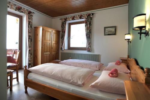 מיטה או מיטות בחדר ב-Haus am Mühlbach
