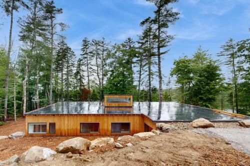 a house in the middle of a forest at Hideaway House in Hope