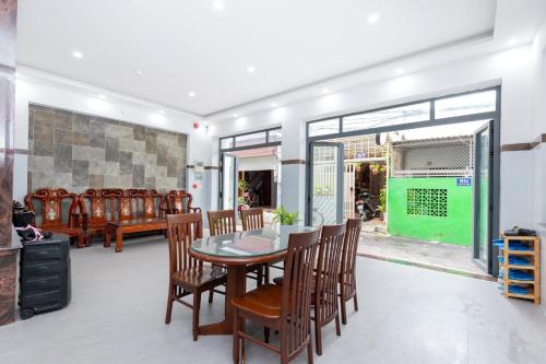 a dining room with a table and chairs at AMY homestay in Vung Tau