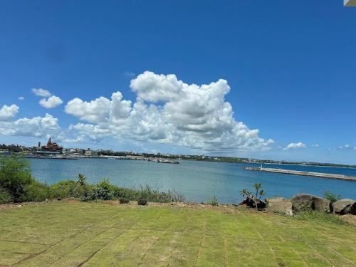 a view of a body of water with a pier at Tidal Stream Sea View B&B in Magong