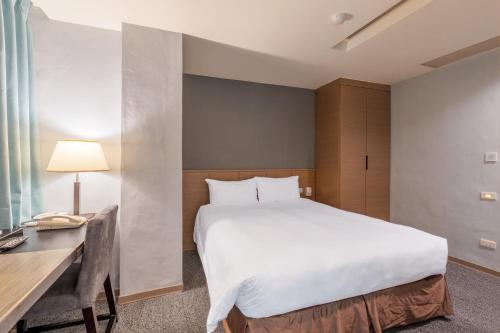 Postel nebo postele na pokoji v ubytování Guide Hotel Taipei Chongqing
