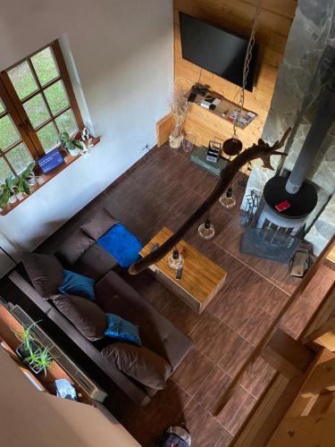 an overhead view of a living room with a brown couch at Dom Na Wzgórzu 479, The House on the hill in Sułkowice