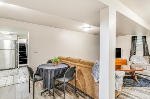 a living room with a table and a couch at Cozy Sturgis Retreat - Walk to Main St and Saloons! in Sturgis