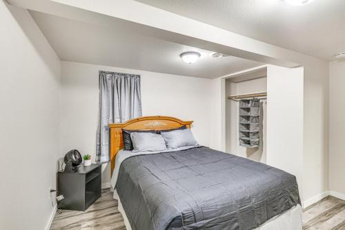 a bedroom with a bed and a window at Cozy Sturgis Retreat - Walk to Main St and Saloons! in Sturgis
