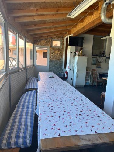 a room with a long table in a house at Sonnen Brijeg in Mrkonjić Grad