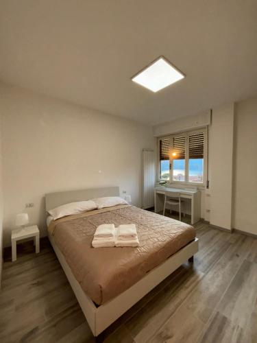 Postel nebo postele na pokoji v ubytování DaMa - Parcheggio Privato - Vista Lago