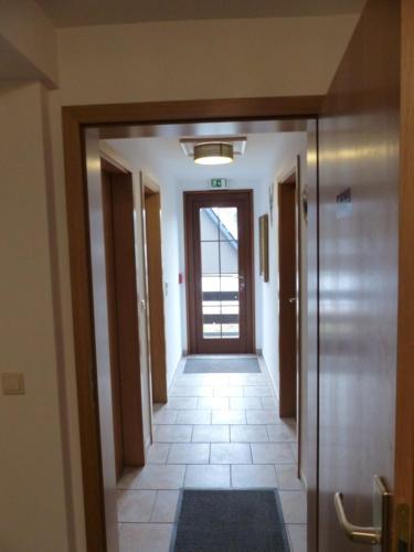 an empty hallway with a door in a building at Ferienwohnung in 09548 Seiffen bis maximal 18 Personen in Kurort Seiffen
