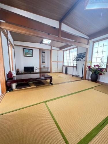 a large room with a ping pong table in it at 板東ビル in Tokyo