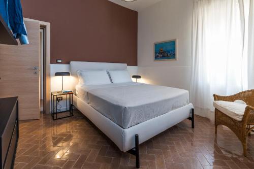 Ένα ή περισσότερα κρεβάτια σε δωμάτιο στο Brezza Marina
