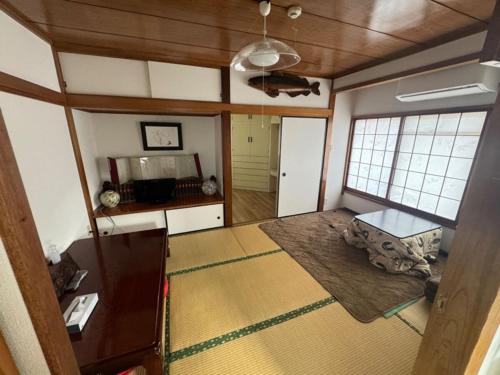 a living room with a couch and a table at 板東ビル in Tokyo