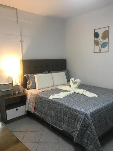 a bedroom with a bed with a bow on it at Albano apartamento 2 en casa vacacional in Mariscal Castilla
