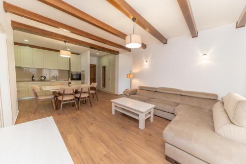 a living room with a couch and a table at Red Hill in Kotor