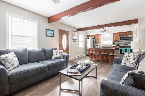 a living room with a couch and a table at The Beautiful & Cozy Malvec Chalet in Tobyhanna
