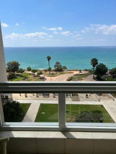 a view of the ocean from a balcony at Natanya Sea View in Netanya