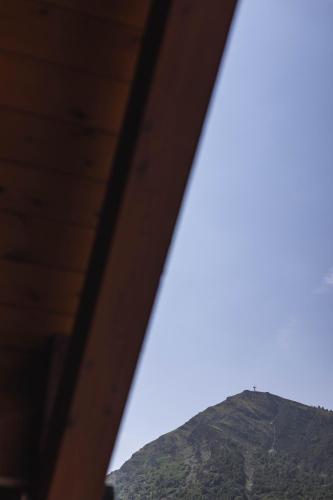 a view of a mountain through a window at Le Rioumajou 1 - Grand T6 - Piscine - Centre St Lary in Saint-Lary-Soulan